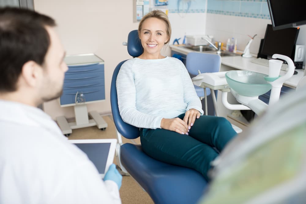 charming woman visiting dentist QG6XD2V 1