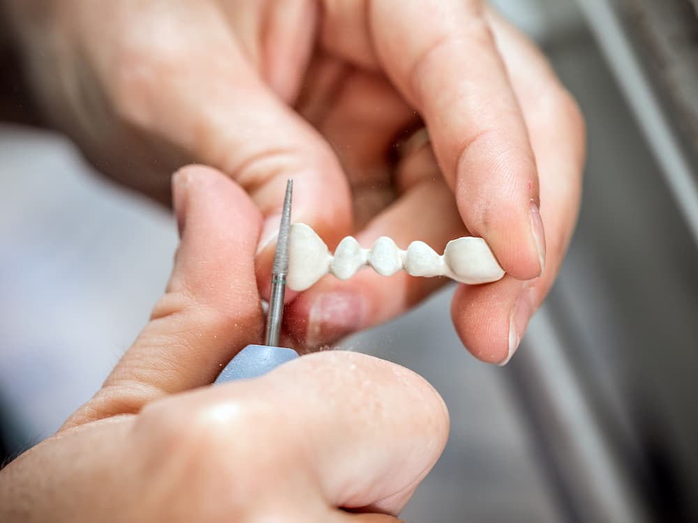 dental technician molding teeth PR2B5LA 1