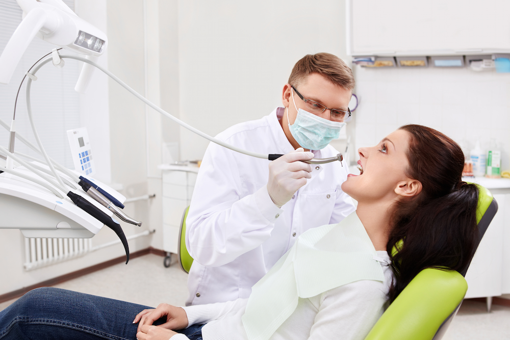 the dentist treats teeth of patient 2022 02 22 16 53 04 utc 1
